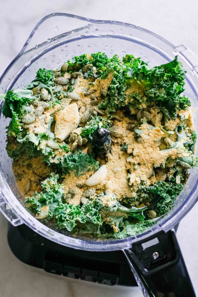kale, nutritional yeast, garlic, nuts, and olive oil in a food processor