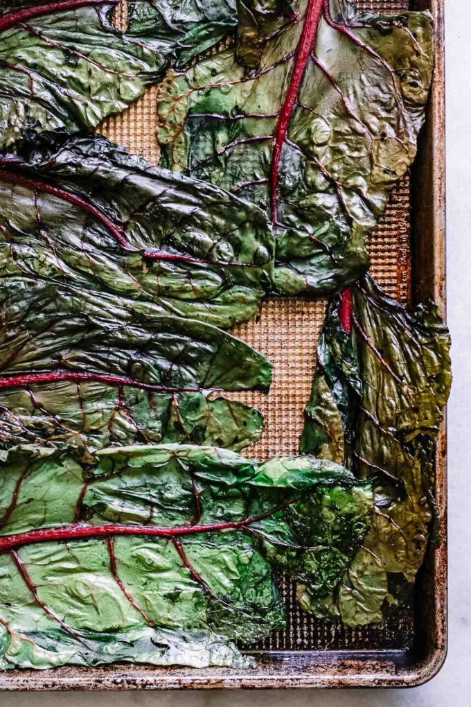 cooked chard leaves on a sheet pan