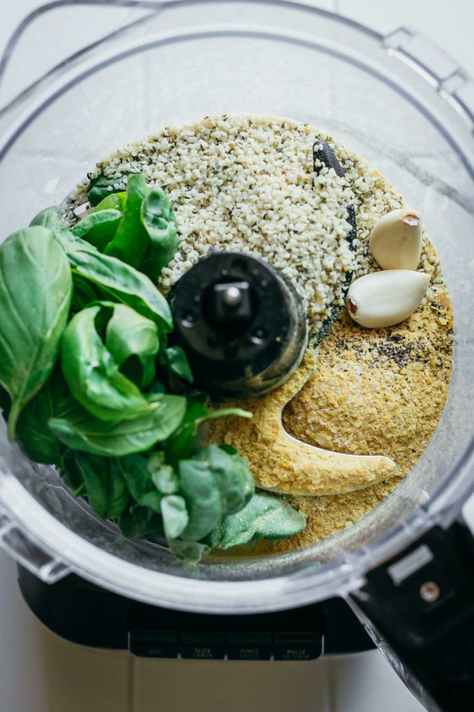 basil, hemp seeds, garlic, cheese, salt, and pepper in a food processor