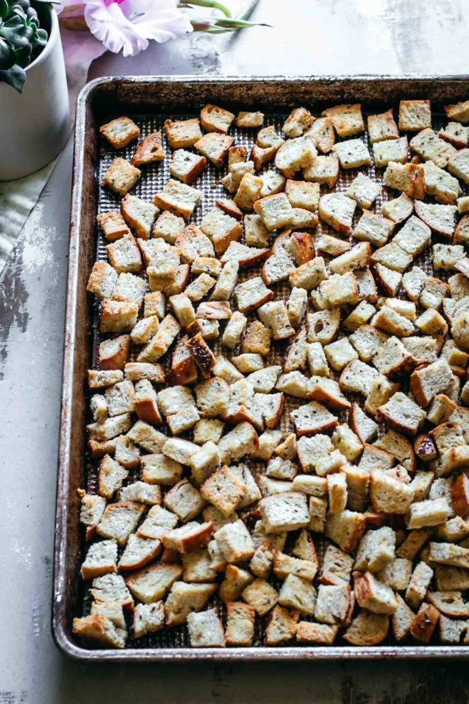 roasted rye bread croutons on a roasting pan