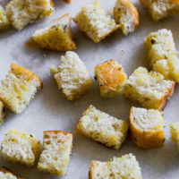 baked sourdough croutons on a white counter