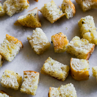 baked sourdough croutons on a white counter