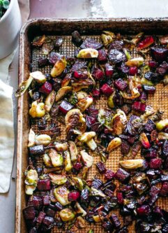 roasted beets and brussels sprouts on a baking sheet