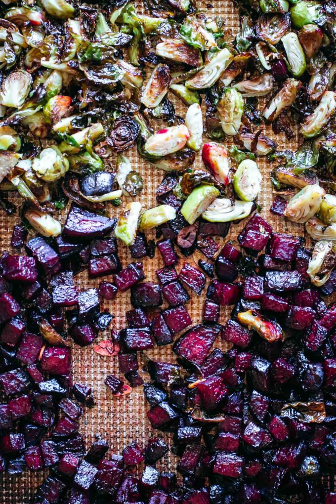 baked brussels sprouts and beets on a pan