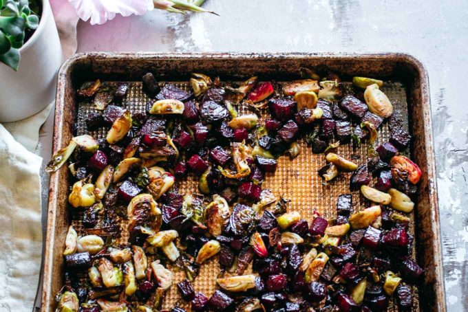 baked beets and brussels sprouts on a roasting pan