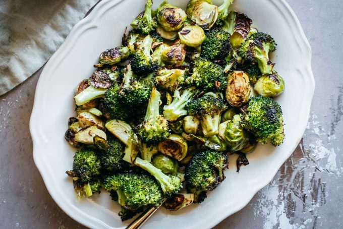 baked broccoli and brussels sprouts on a platter