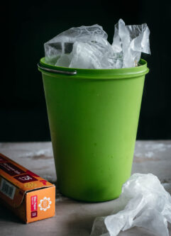 crumpled wax paper in a compost bin