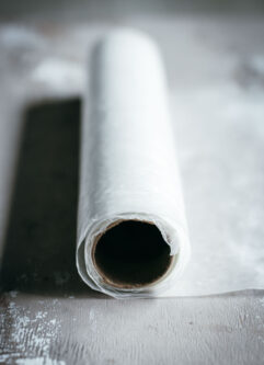 side view of a roll of wax paper on a countertop