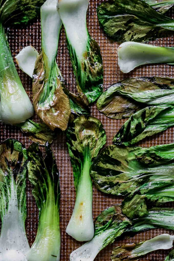 baked crispy bok choy chips on a baking sheet