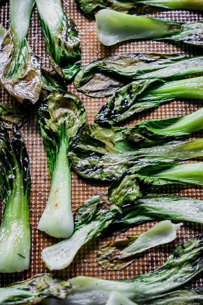 oven baked bok choy on a roasting pan