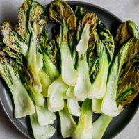 bok choy chips on a blue plate