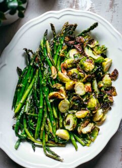 roasted brussels sprouts and asparagus in a serving dish