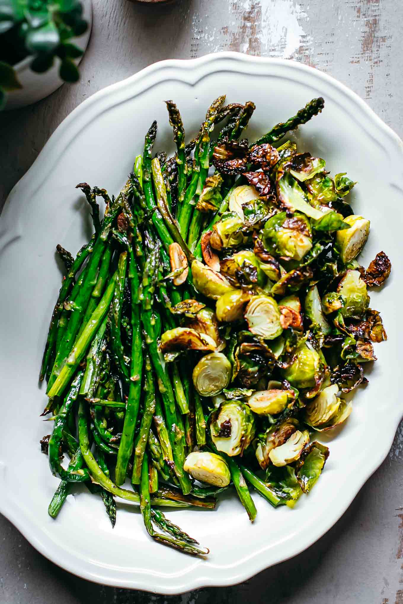 roasted brussels sprouts and asparagus in a serving dish