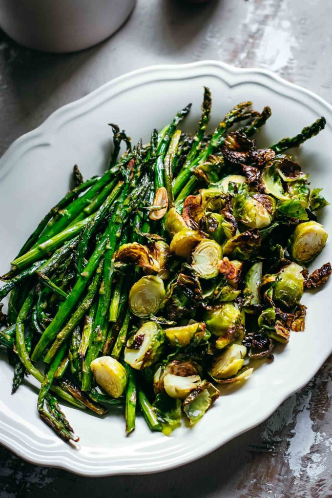 close up of oven baked brussels sprouts and asparagus