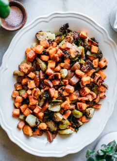 roasted brussels sprouts and sweet potatoes in a serving dish