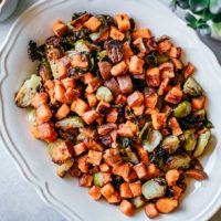 roasted brussels sprouts and sweet potatoes on a platter