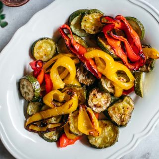 roasted zucchini and bell peppers on a white plate