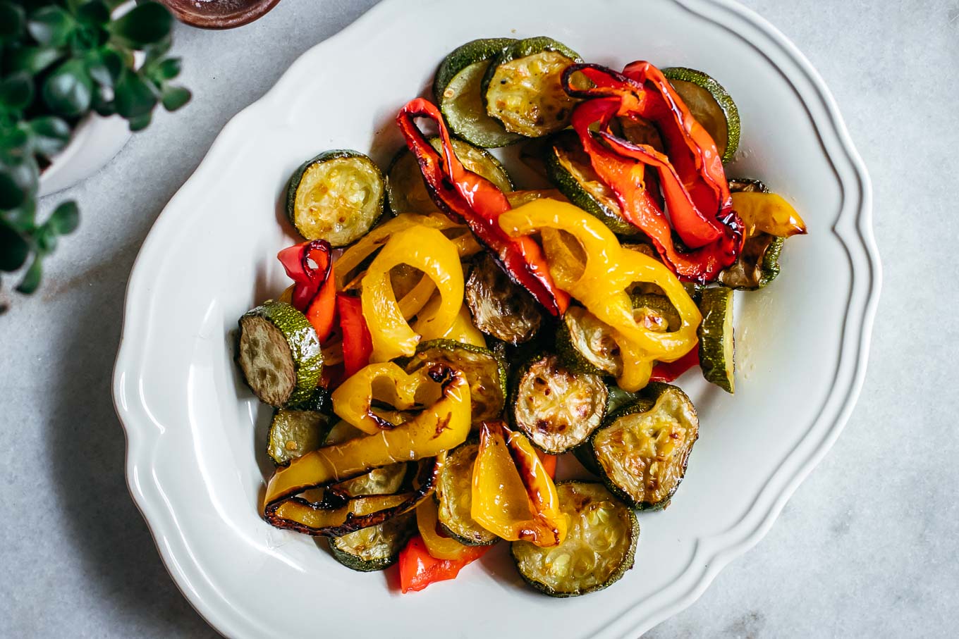 roasted zucchini and bell peppers on a white plate