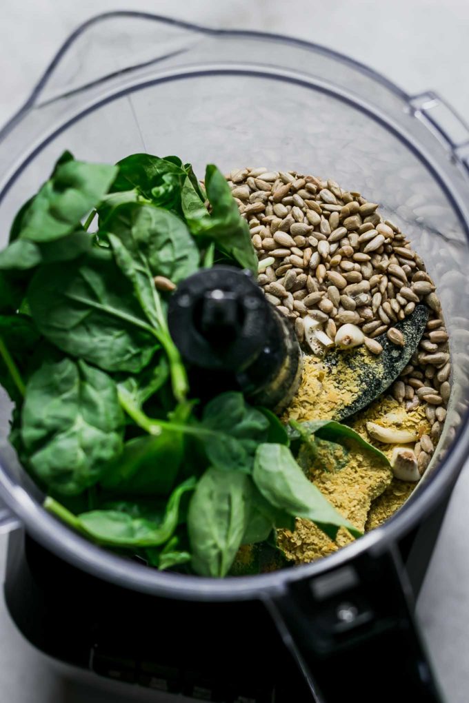 spinach leaves, pine nuts, garlic and seasonings in a food processor