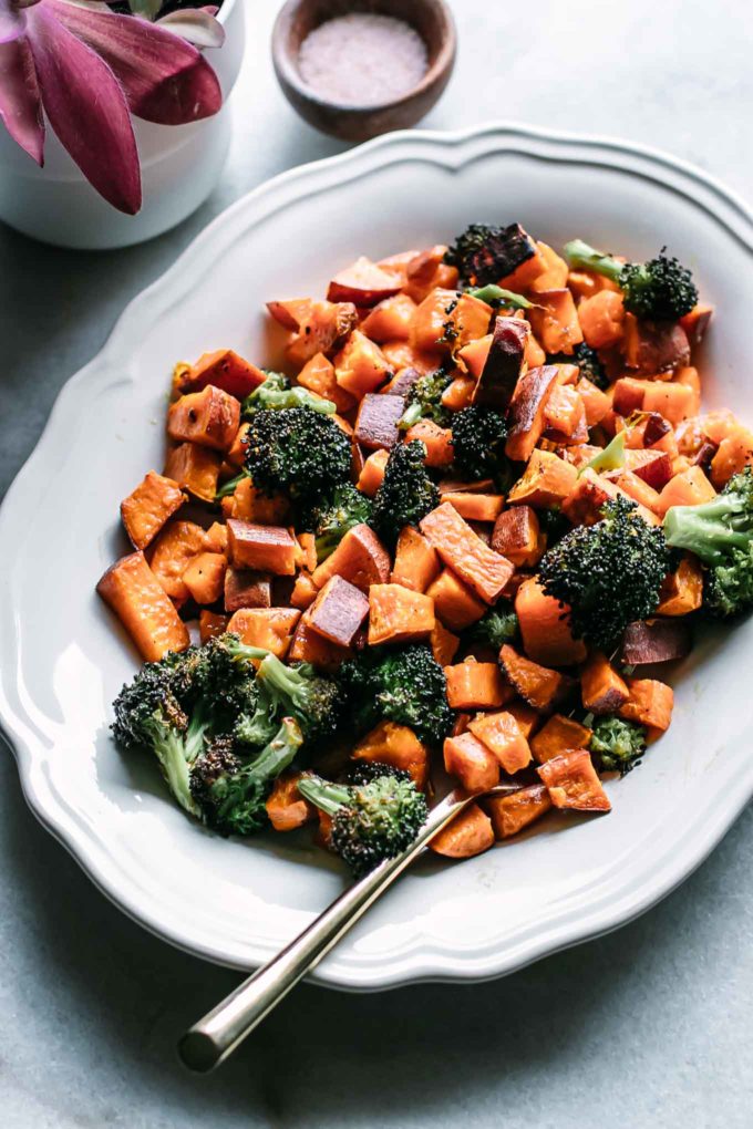 roasted broccoli and carrots on a white plate