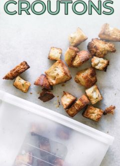 a photo of a silicon freezer bag filled with frozen croutons and the words "how to freeze and thaw croutons" in green writing