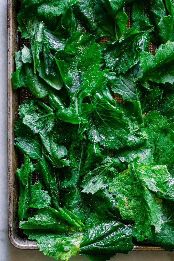 seasoned turnip greens on a baking sheet