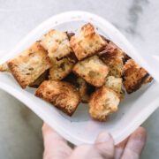 croutons in a silicon freezer bag on a white countertop