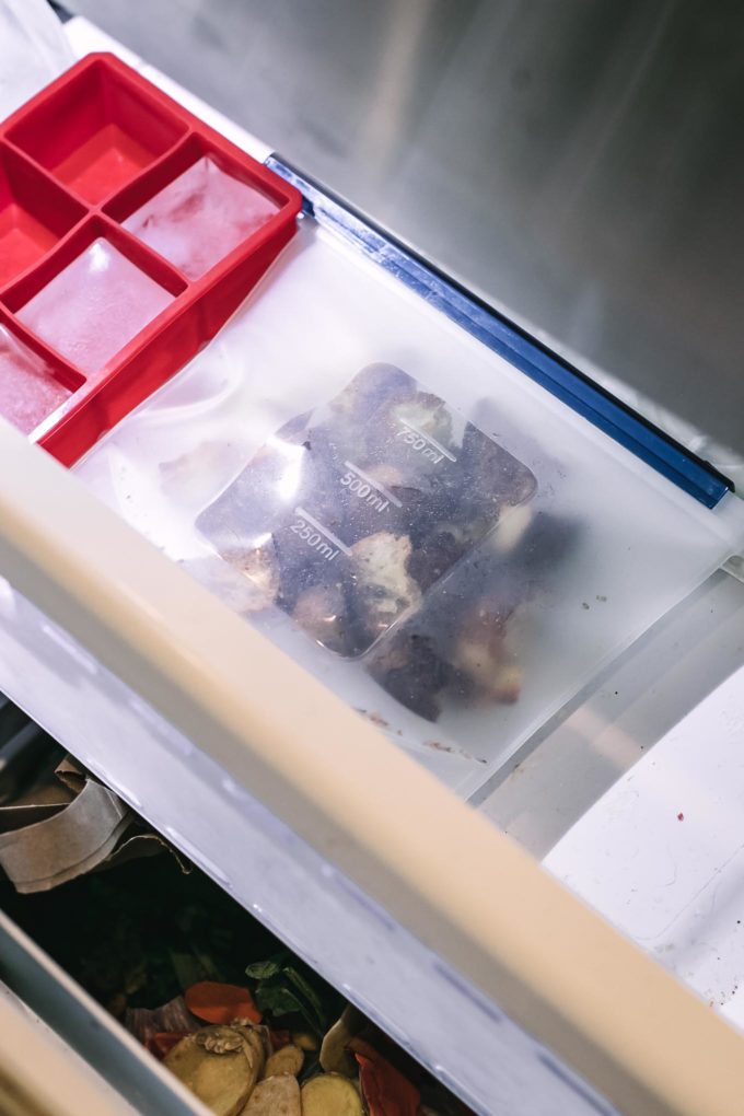 a silicone freezer bag filled with croutons inside a freezer drawer