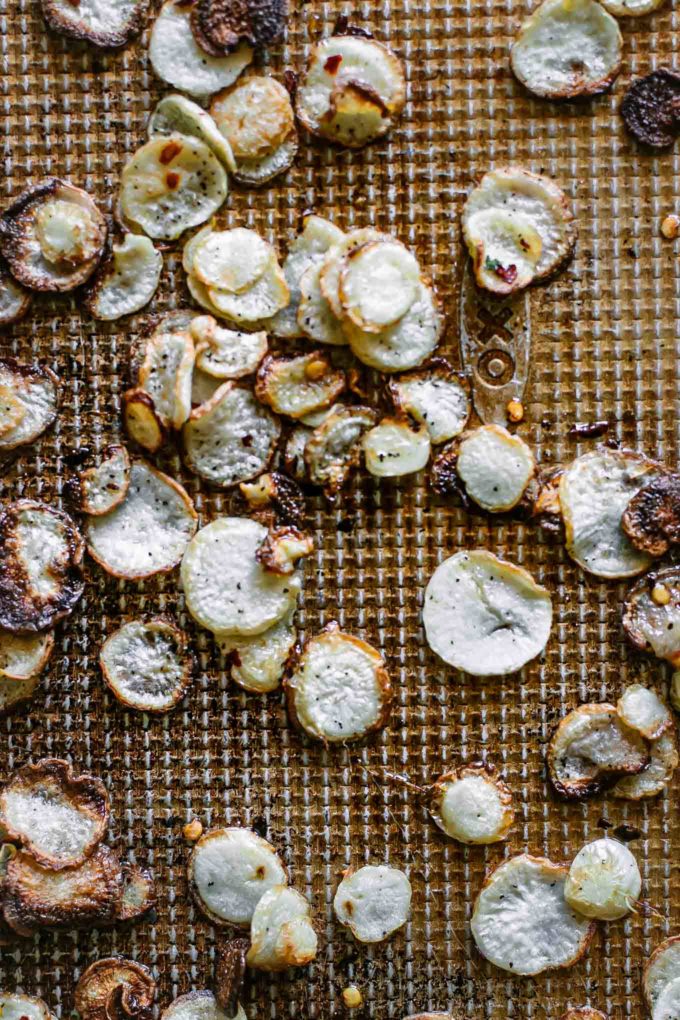 roasted turnip slices on a baking sheet