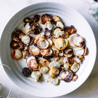 roasted turnip chips in a white bowl