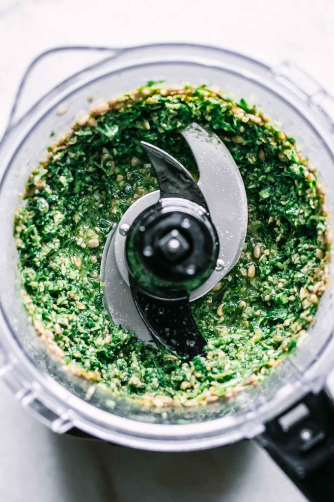 blended ingredients for turnip greens pesto in a food processor
