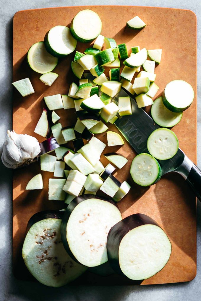 sliced eggplants and zucchini on a wood cutting board
