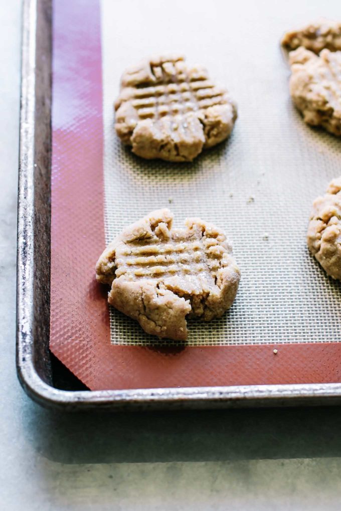 baked cookies on a slicone baking mat on a sheet pan