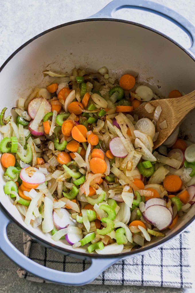 cooked radishes, onions, carrots, and celery in a large dutch oven