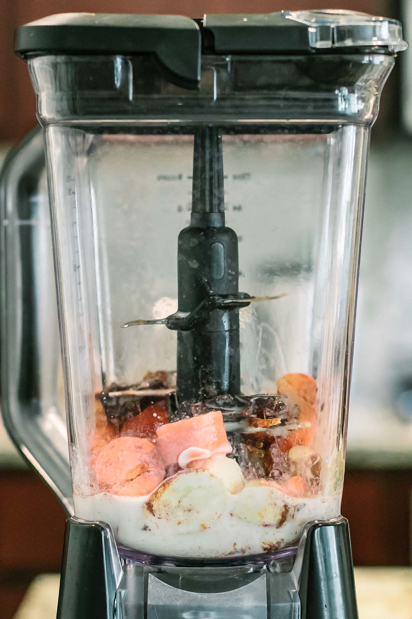 carrots and banana in a blender for a carrot smoothie