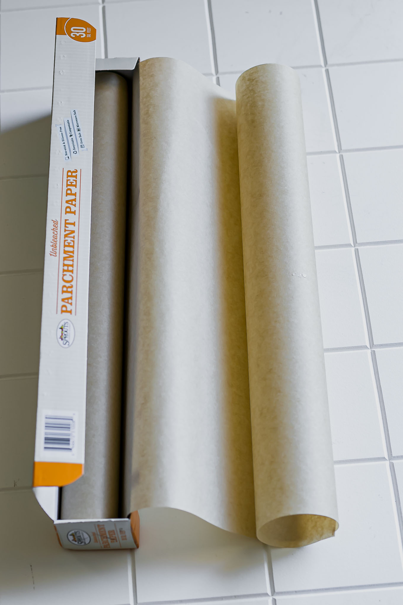 a box of unbleached parchment paper on a white countertop