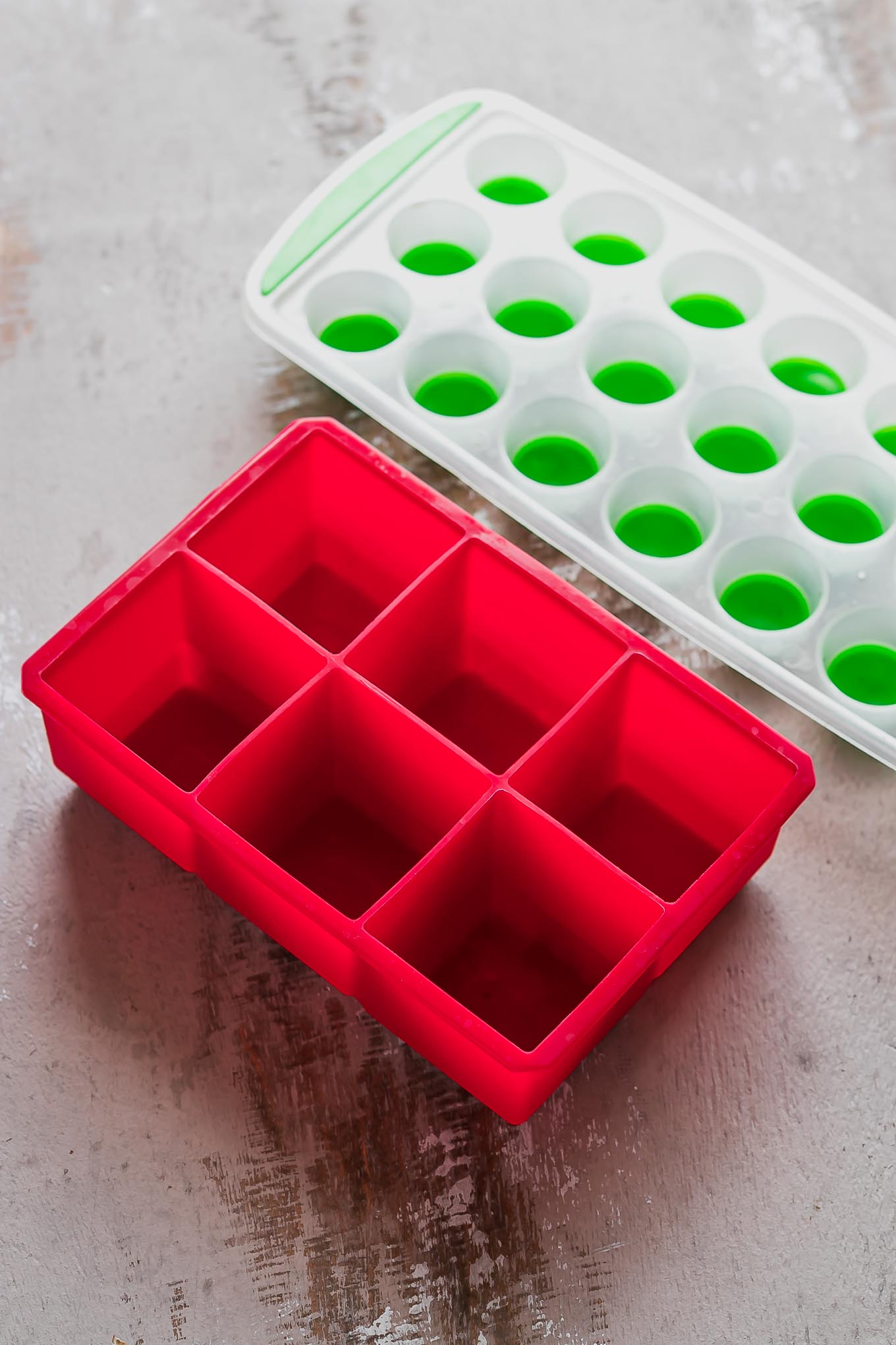 two silicone ice trays on a countertop