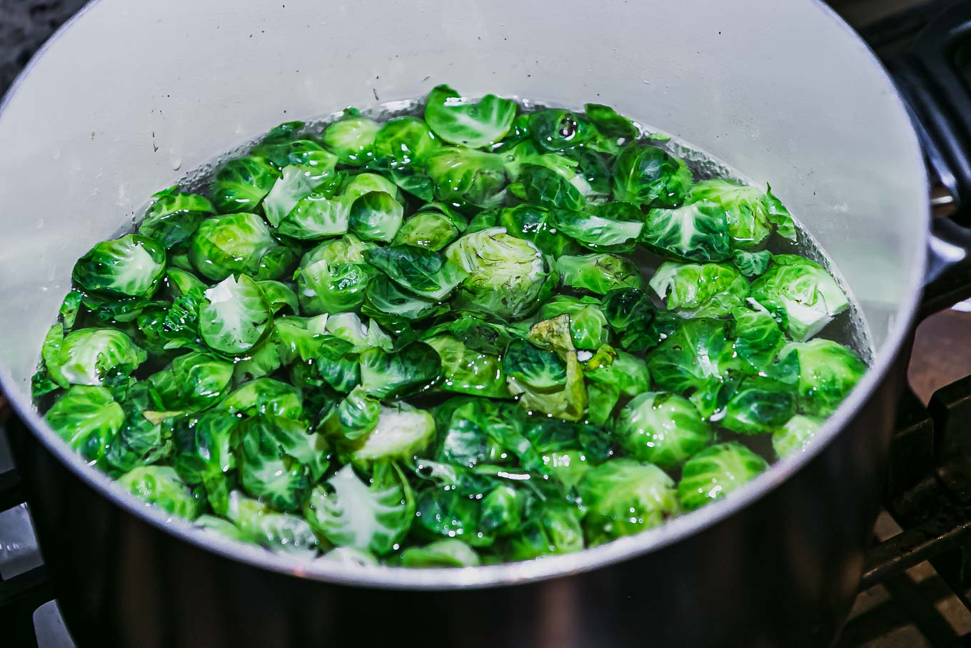 blanched brussels sprouts in a pot of boiling water