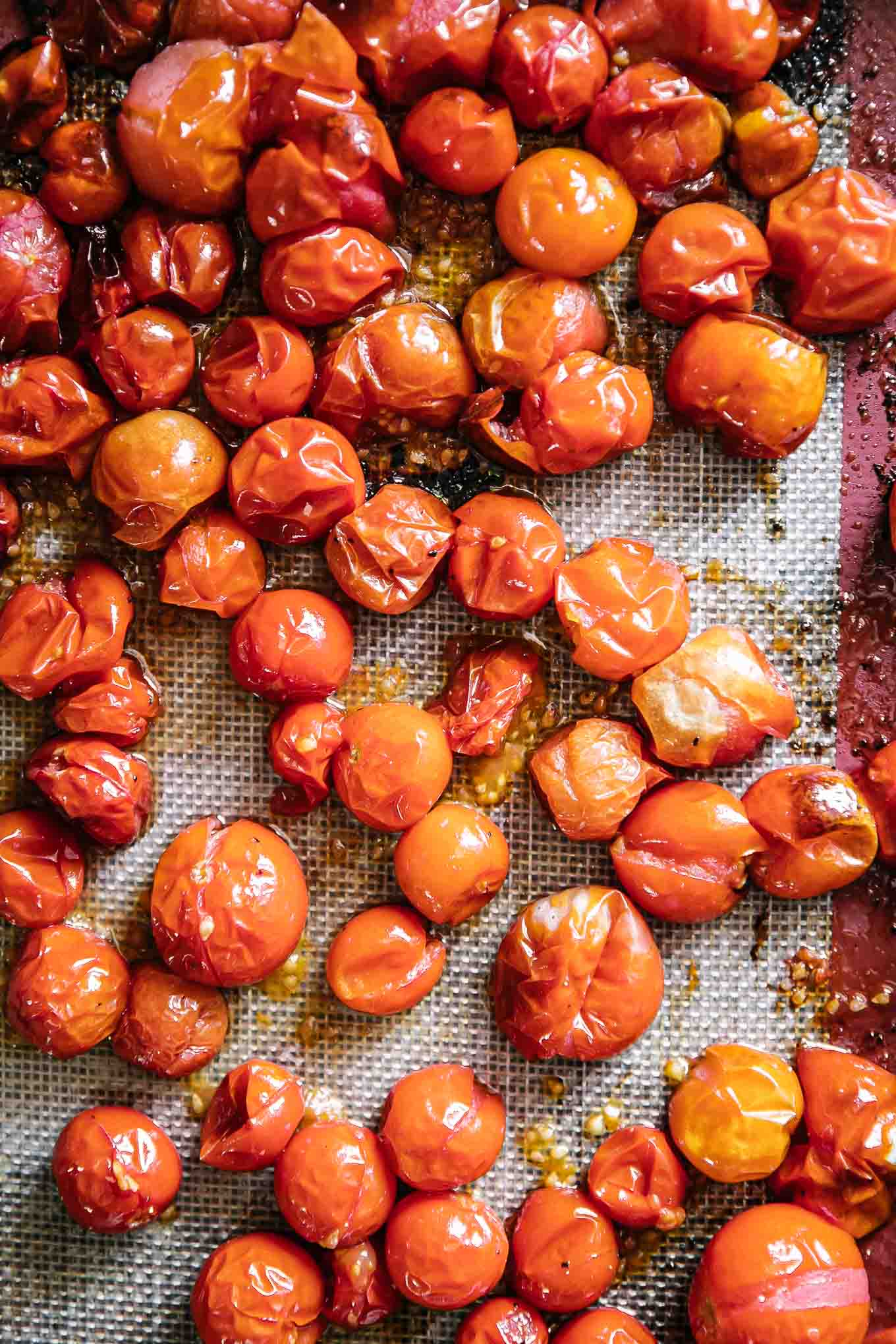 cherry tomatoes on a baking sheet after roasting