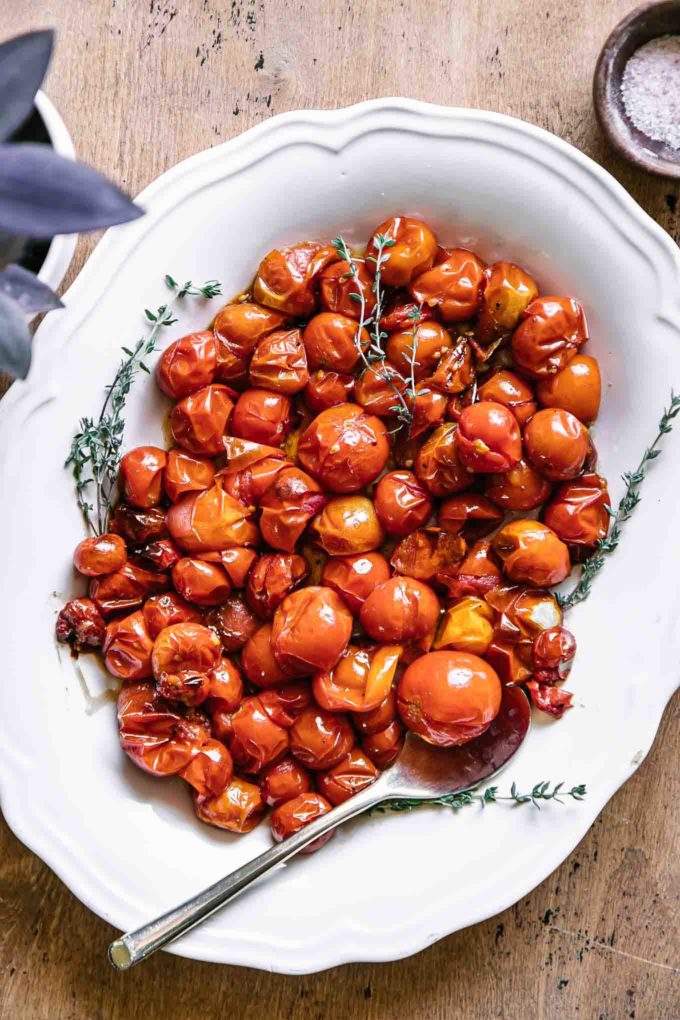 roasted cherry tomatoes on a white side dish