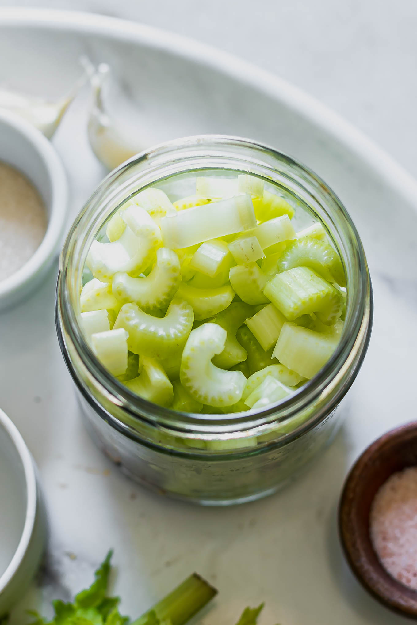 celery slices in a jar before pickling