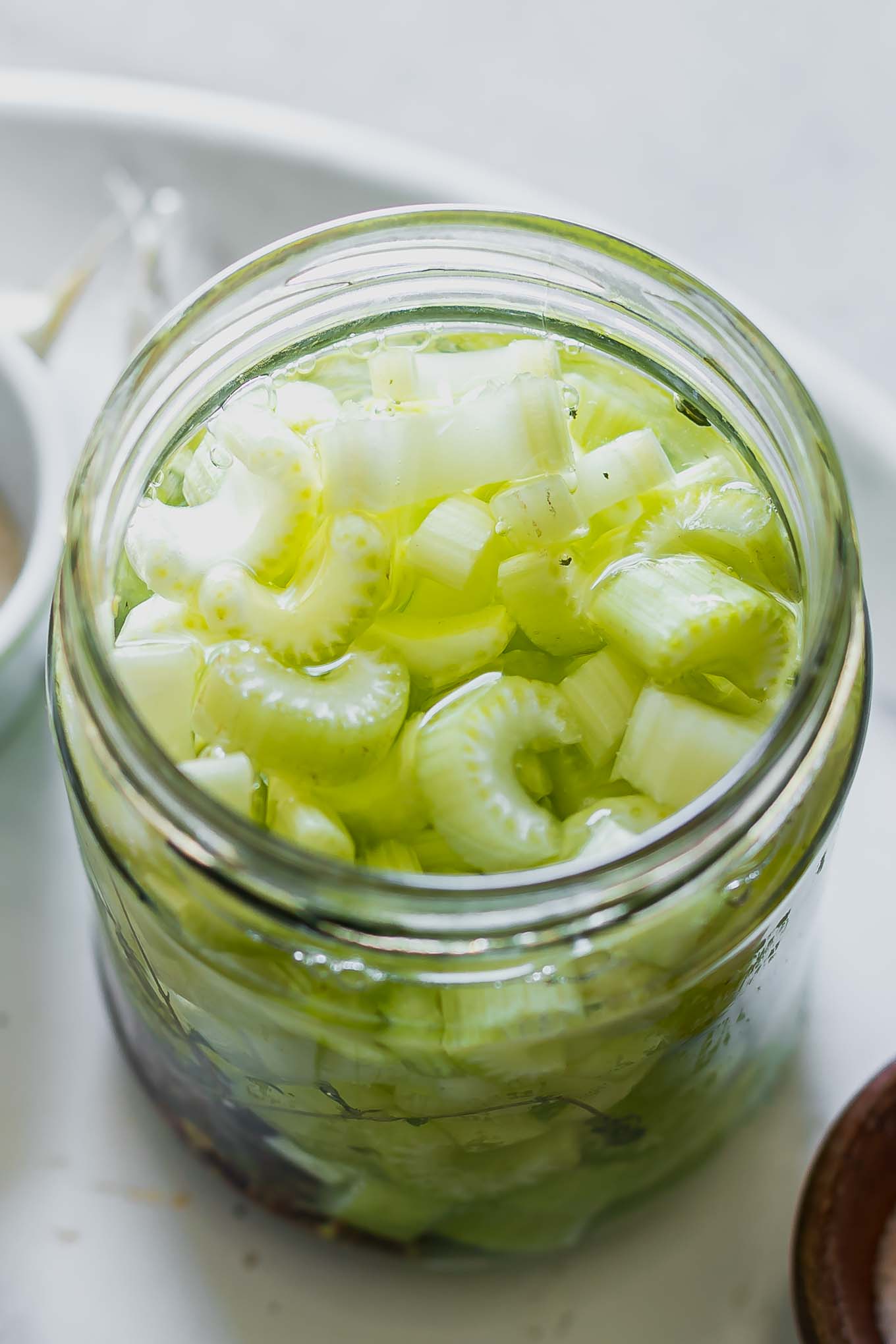 celery slices in a jar with pickling brine