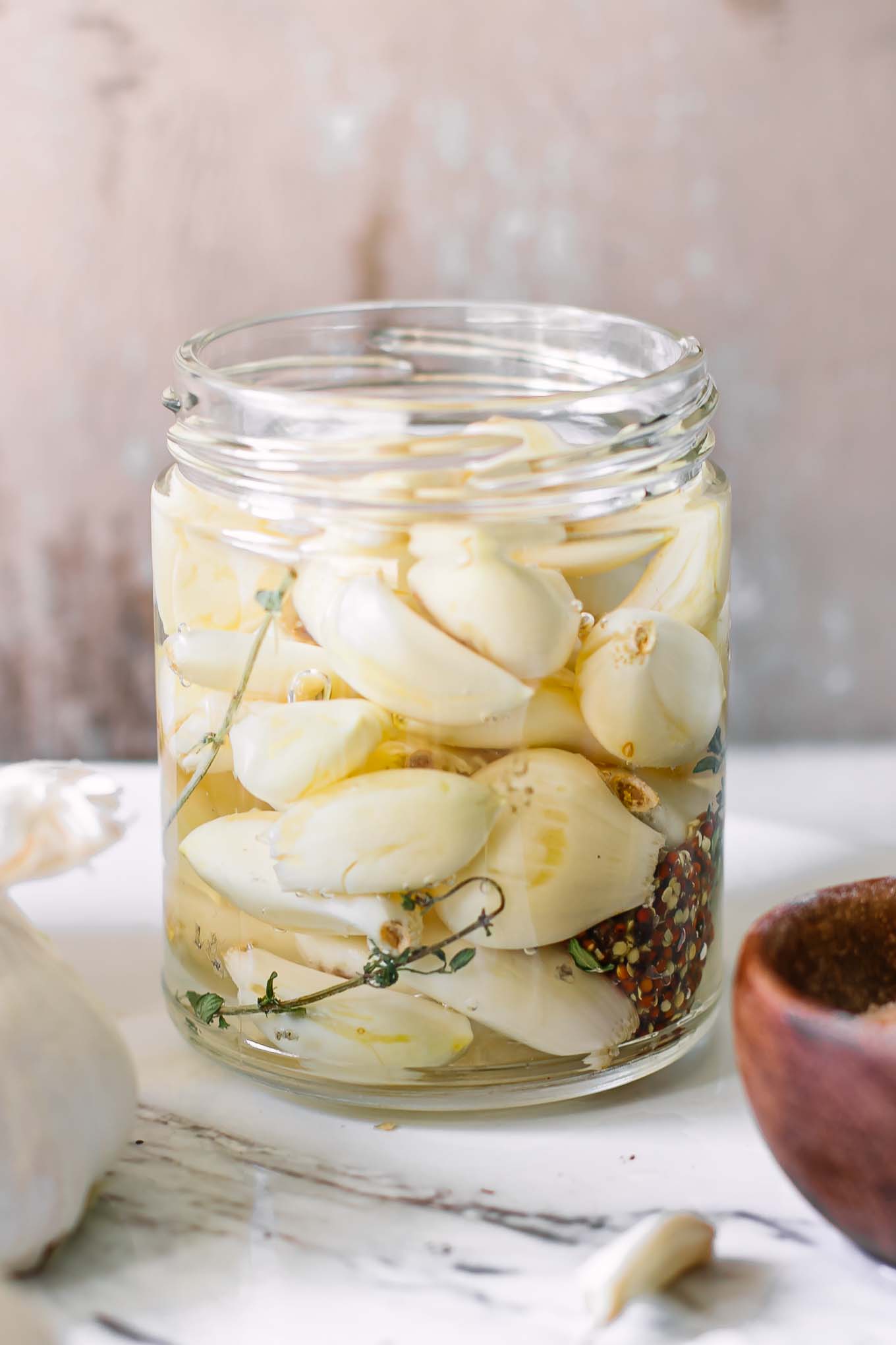 a jar of pickled vegetables on on a white table