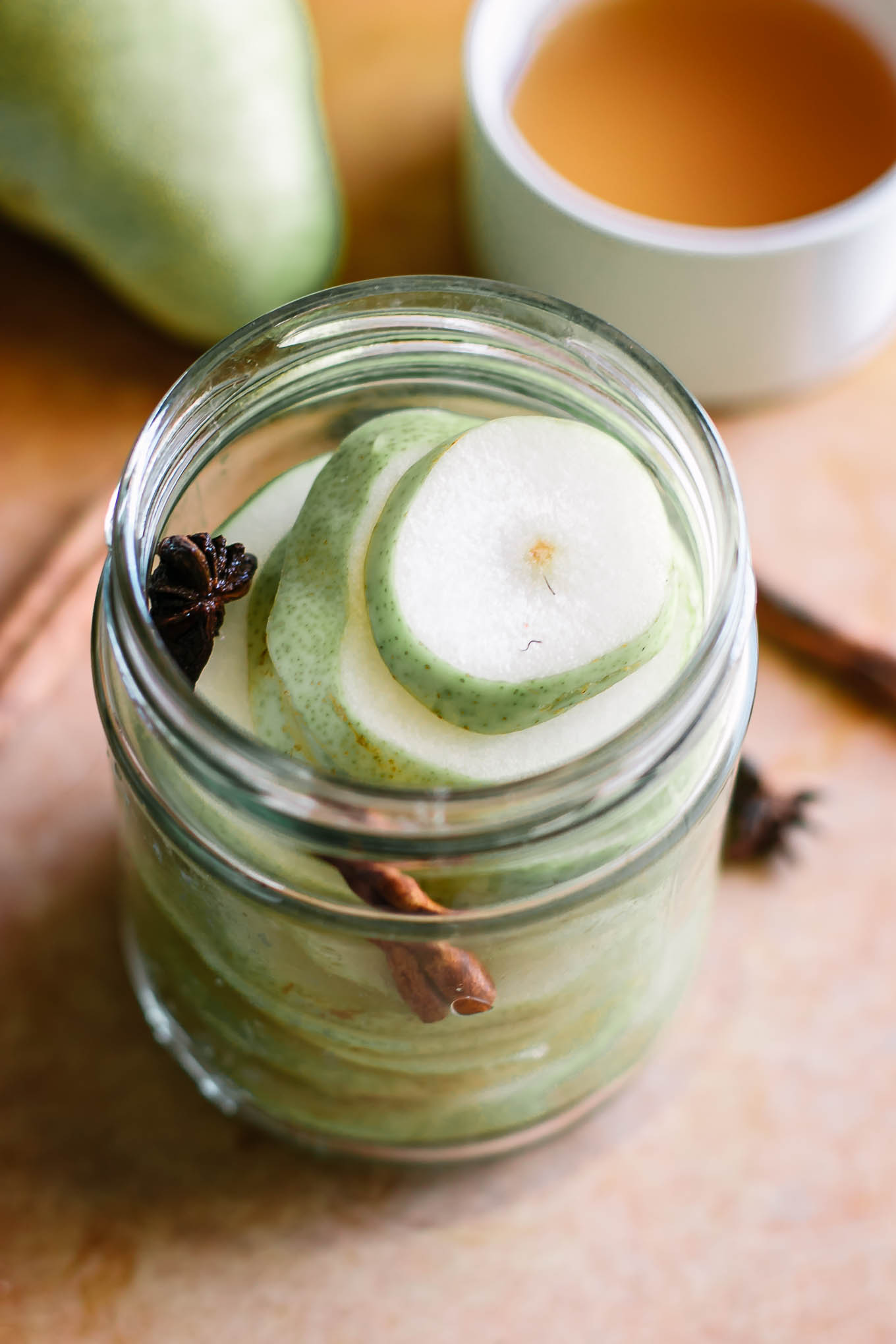 sliced pears inside a jar before pickling