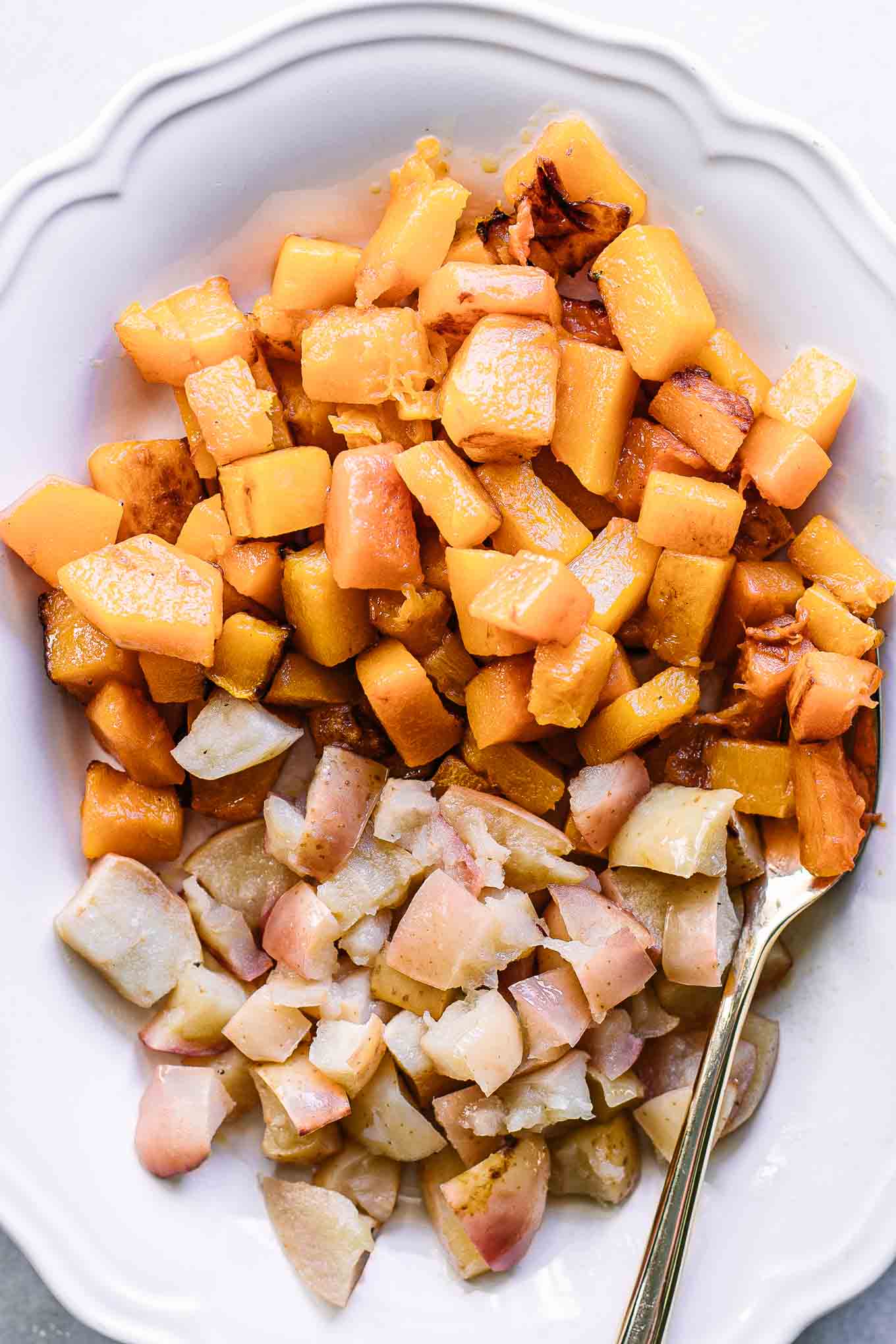 a close up photo of baked butternut squash and apples