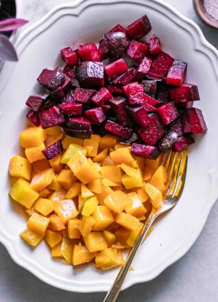 roasted beets and butternut squash on a white side dish