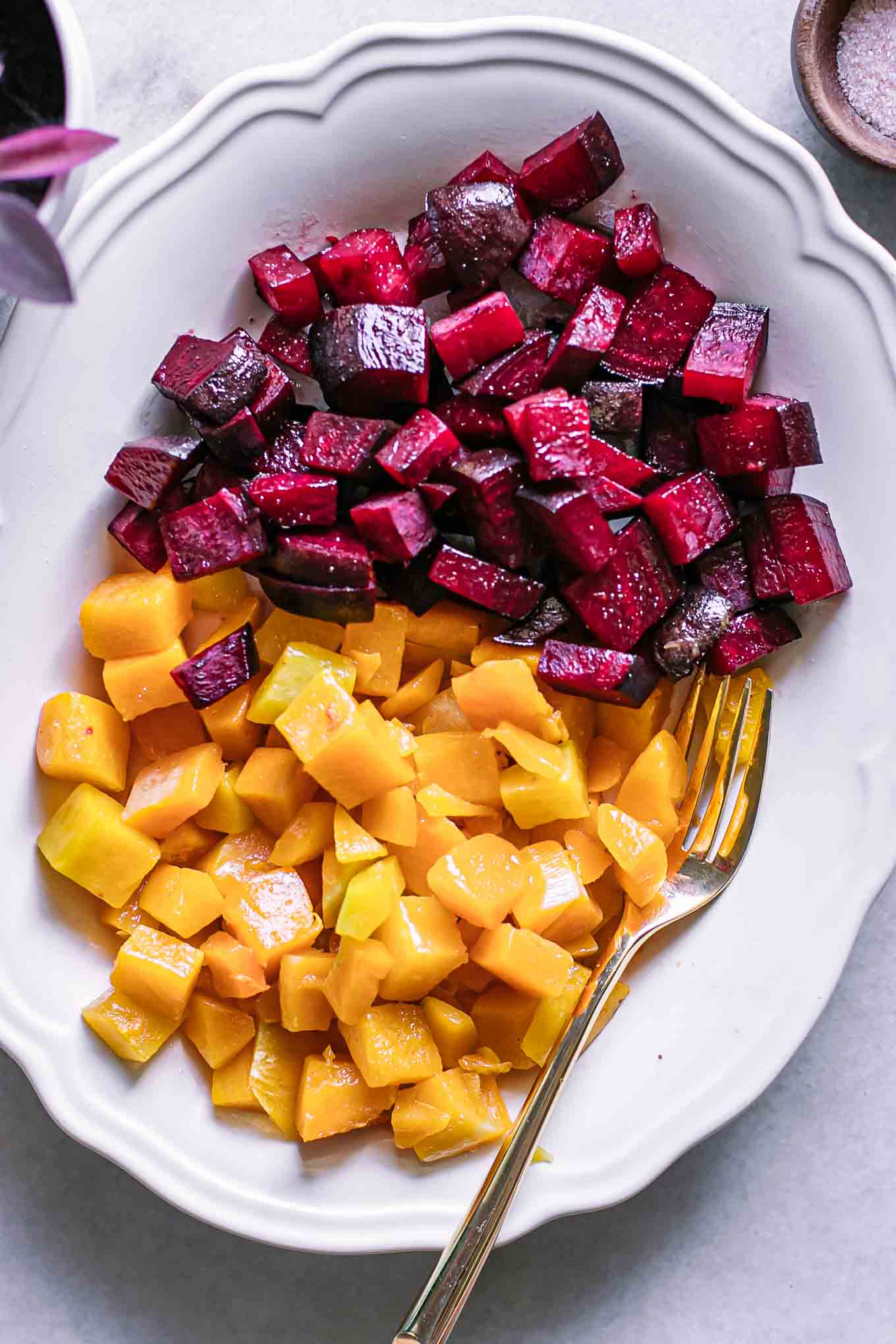 roasted beets and butternut squash on a white side dish