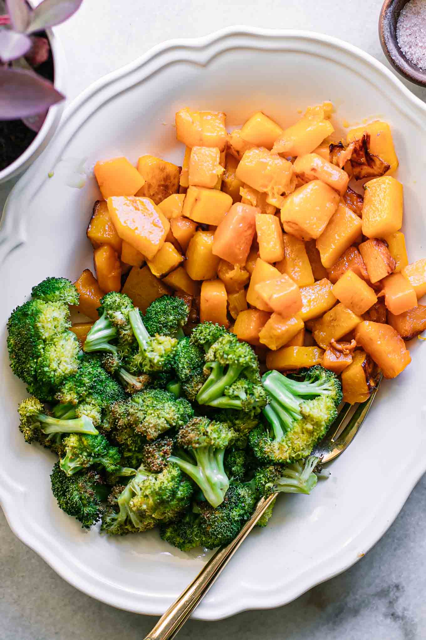 roasted butternut squash and broccoli on a white side dish