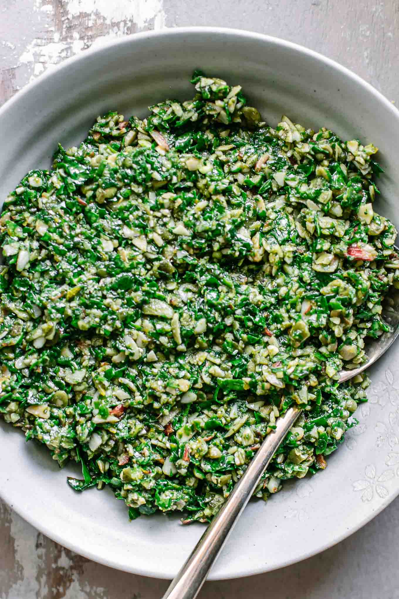 a close up photo of pesto sauce with chard leaves