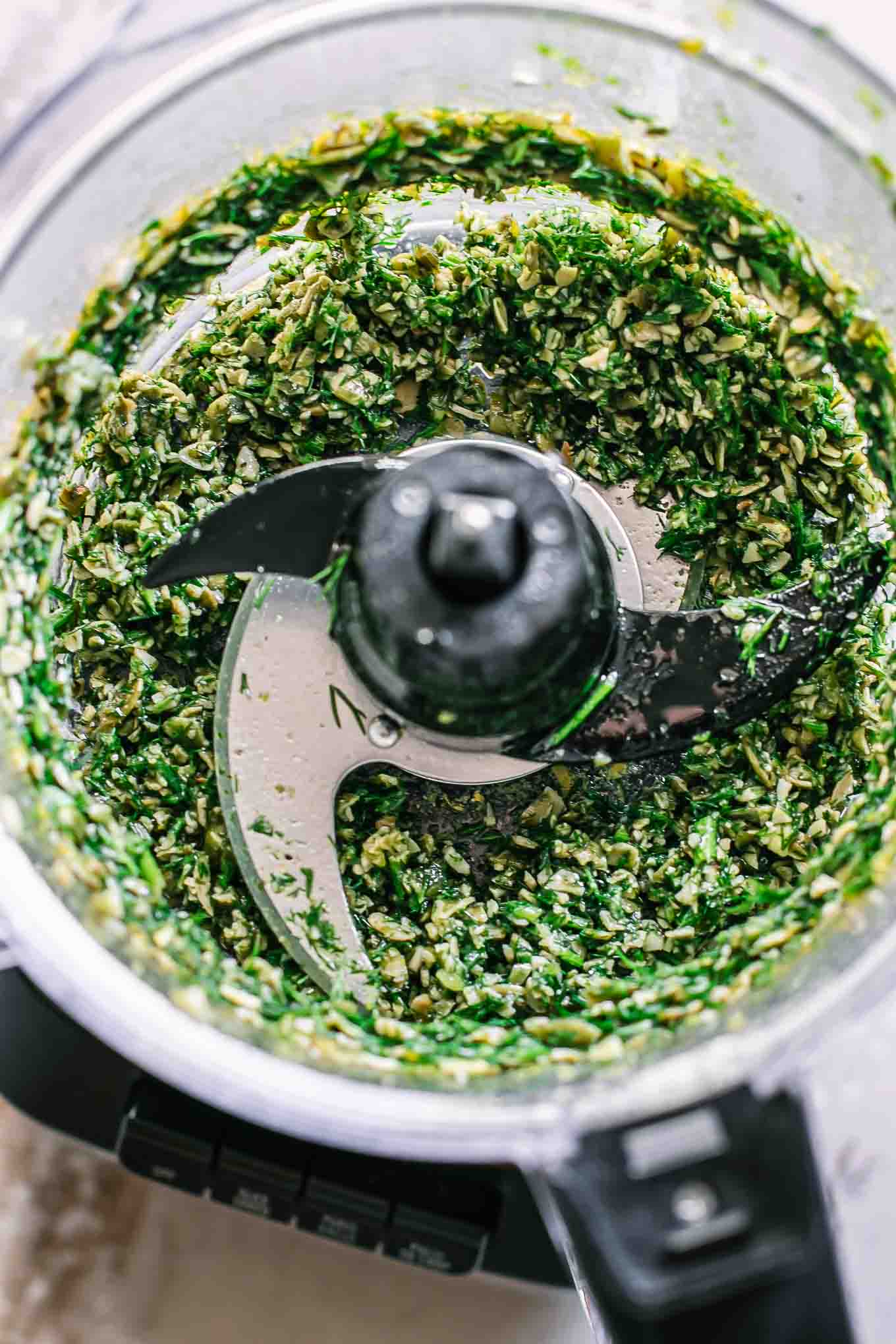 blended dill pesto sauce in a food processor